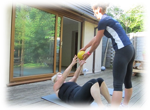Veronika coaching a client through a one-to-one Pilates session